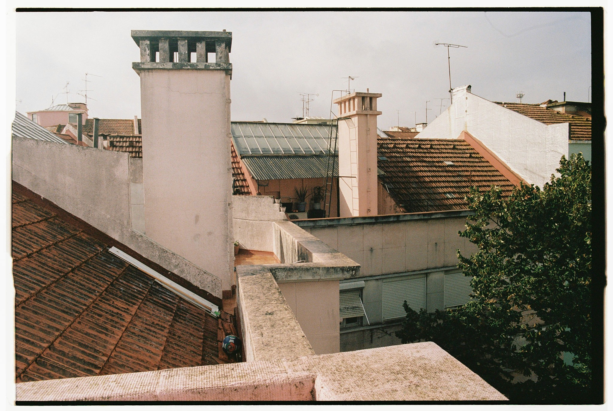 Modern skyscrapers line a busy highway in a sprawling city.