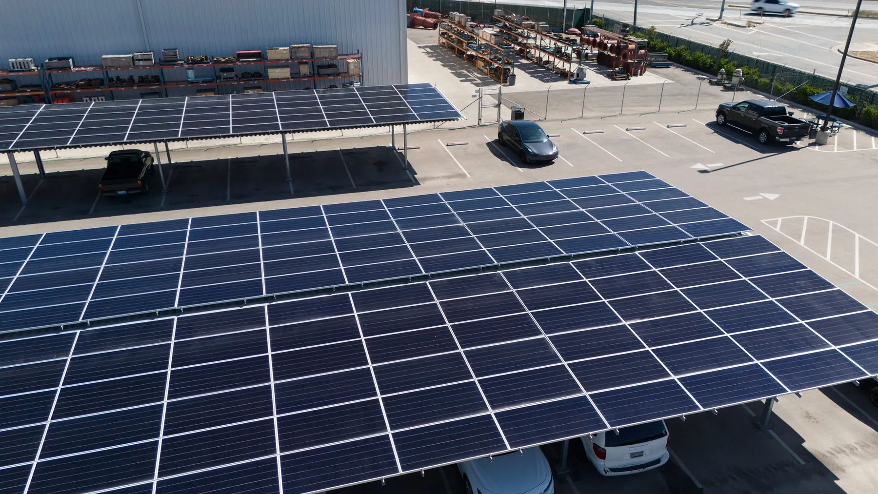 Aerial view of a solar carport over a parking lot, angled view