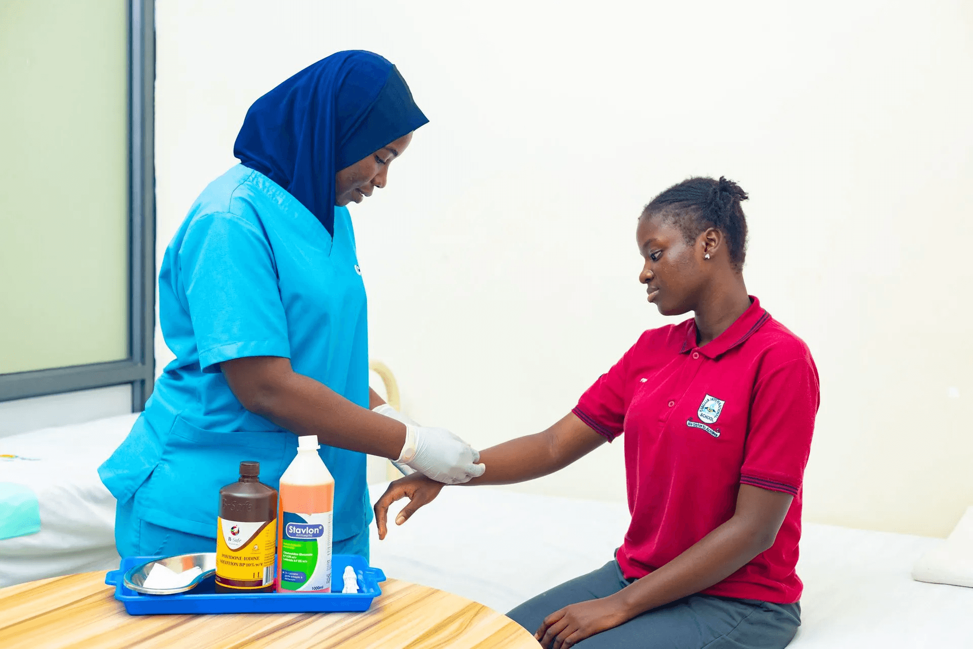 A teacher is helping a student with an assignment