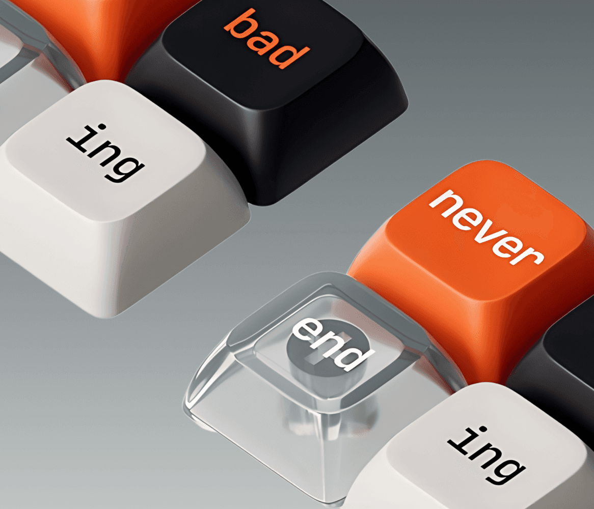 Keyboard with custom orange and black keys labeled "never", "end", and "ing"