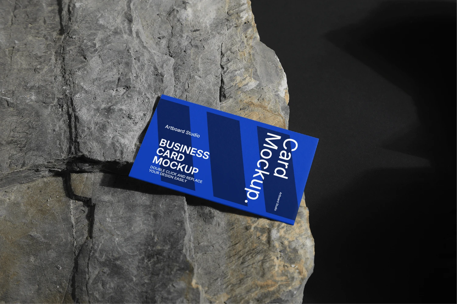 Business card mockup on a rock prop