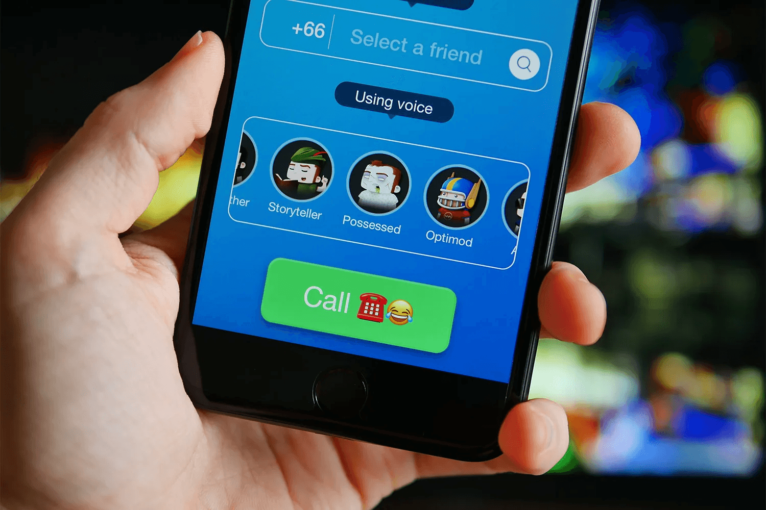 Person holding phone with calling app - Wellsaid Labs Alternative