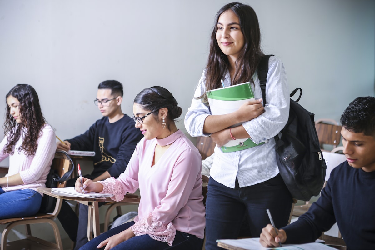 International students reviewing course information on campus