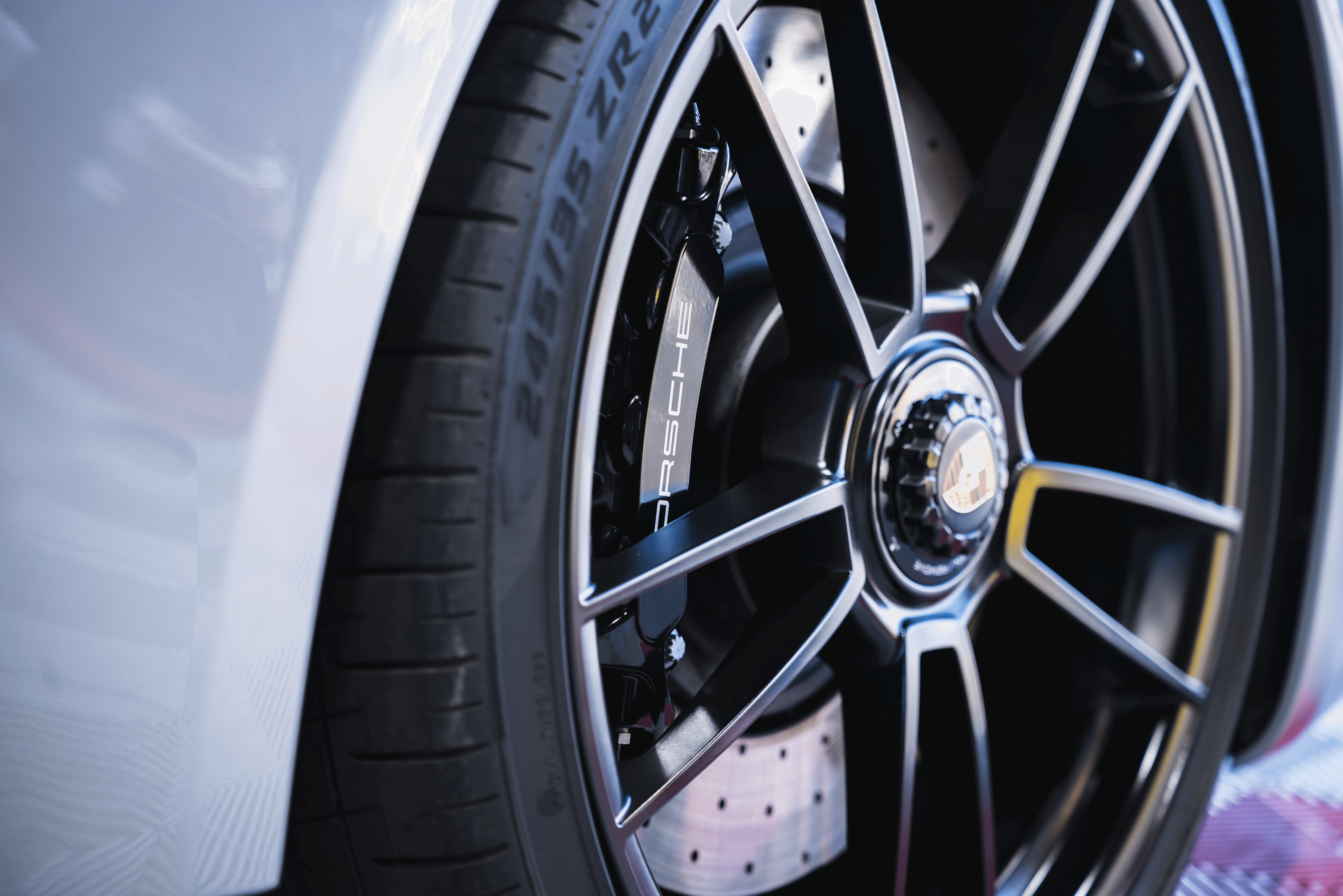 a man working on a car in a garage