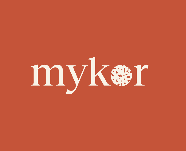 Orange background with Mykor's logo in beige on it