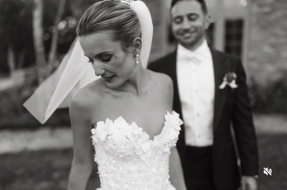 Artistic fashion portrait with colorful floral and avant-garde wallpaper