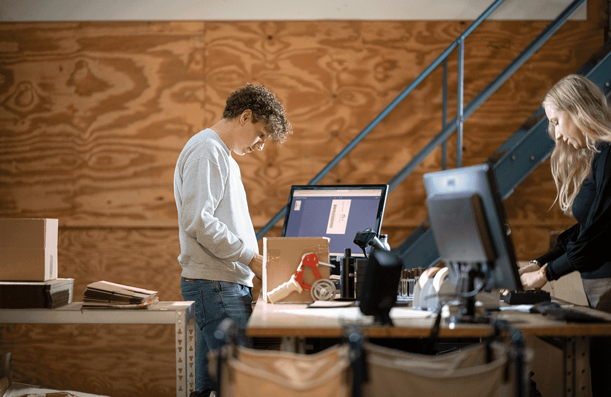 E-commerce business processing orders and shipping parcels