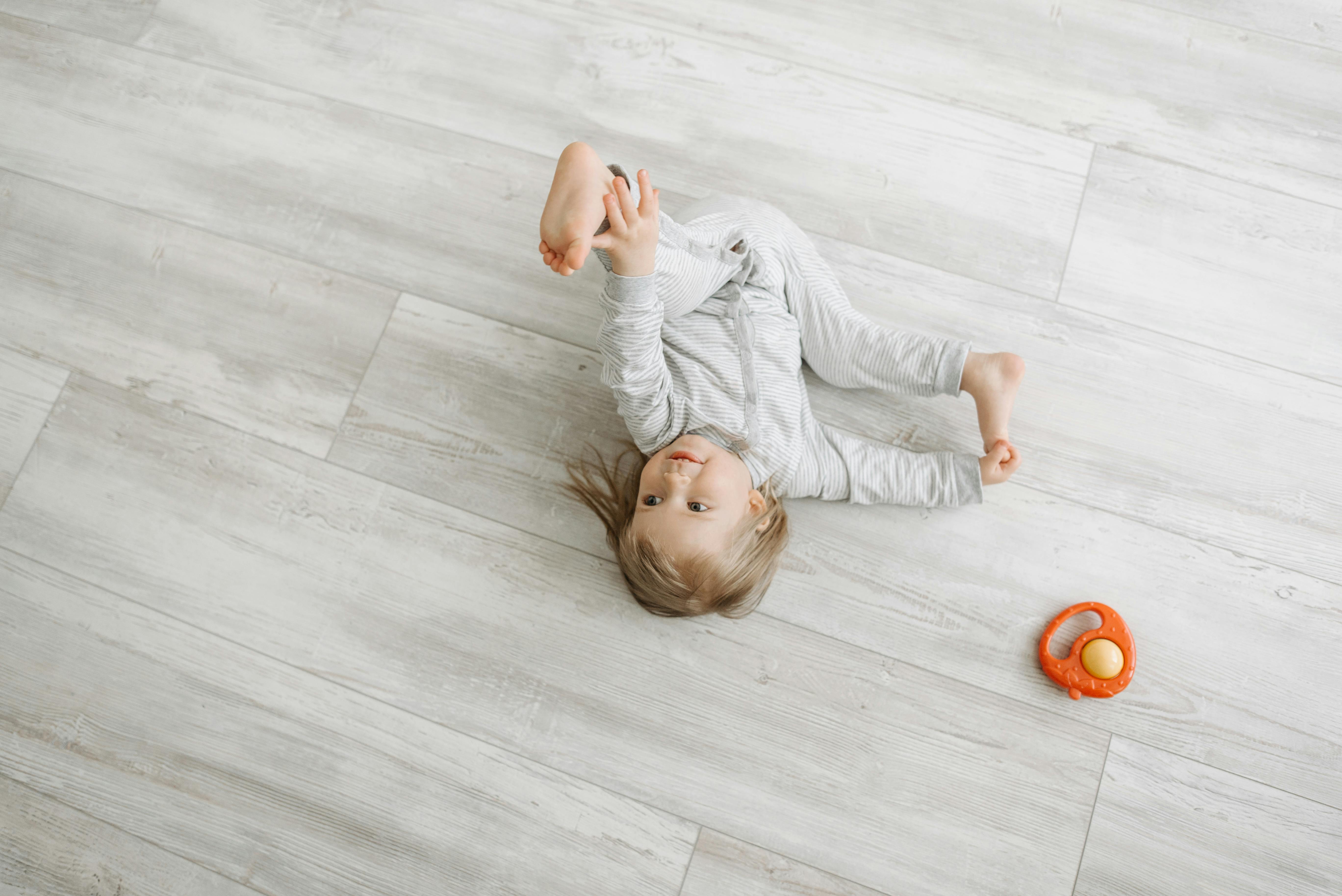 Babies roll everywhere, so slippery floors feel risky — slip-resistant hybrid flooring gives Brisbane homes a safer, softer place for daily play