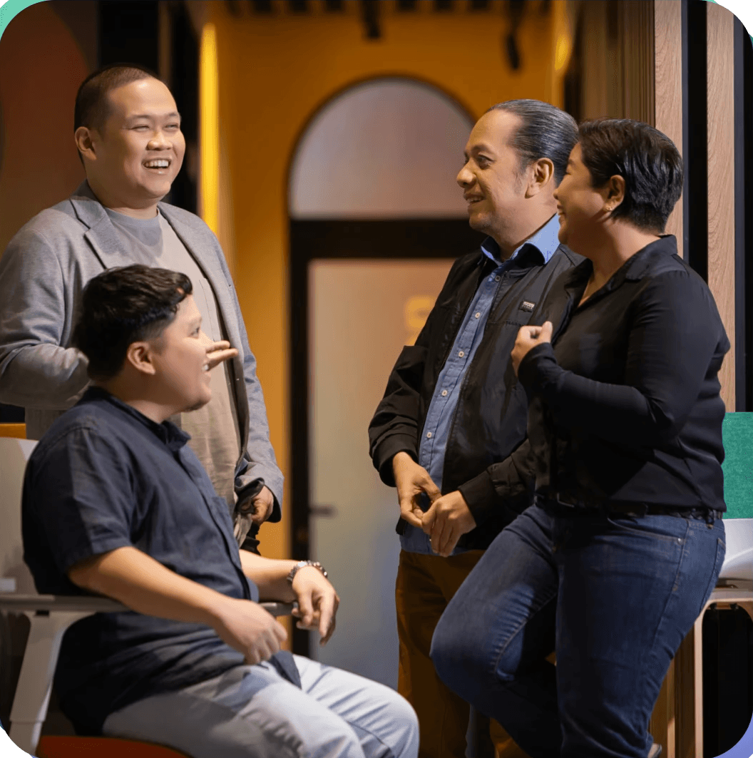 The academy mentors talking with one another.