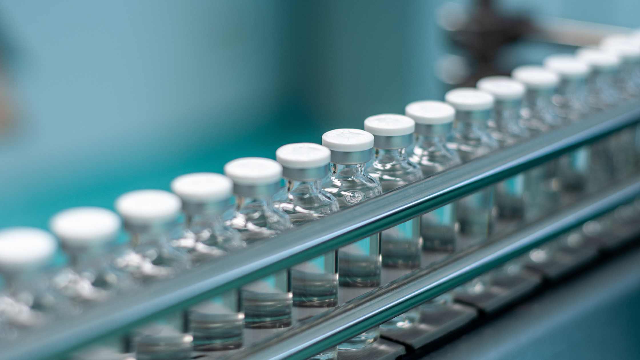 A production line of medicine vials.