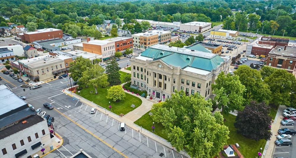 Aerial view of downtown Auburn, Indiana, showing the historic courthouse and surrounding buildings