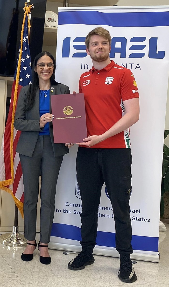 Anat Sultan-Dadon, consul general of Israel to the Southeastern United States, and Robert Shwartzman as  he receives an Israel proclamation from the Alabama Legislature at Barber Motorsports Park on May 2, 2025. Photo courtesy of Larry Brook.