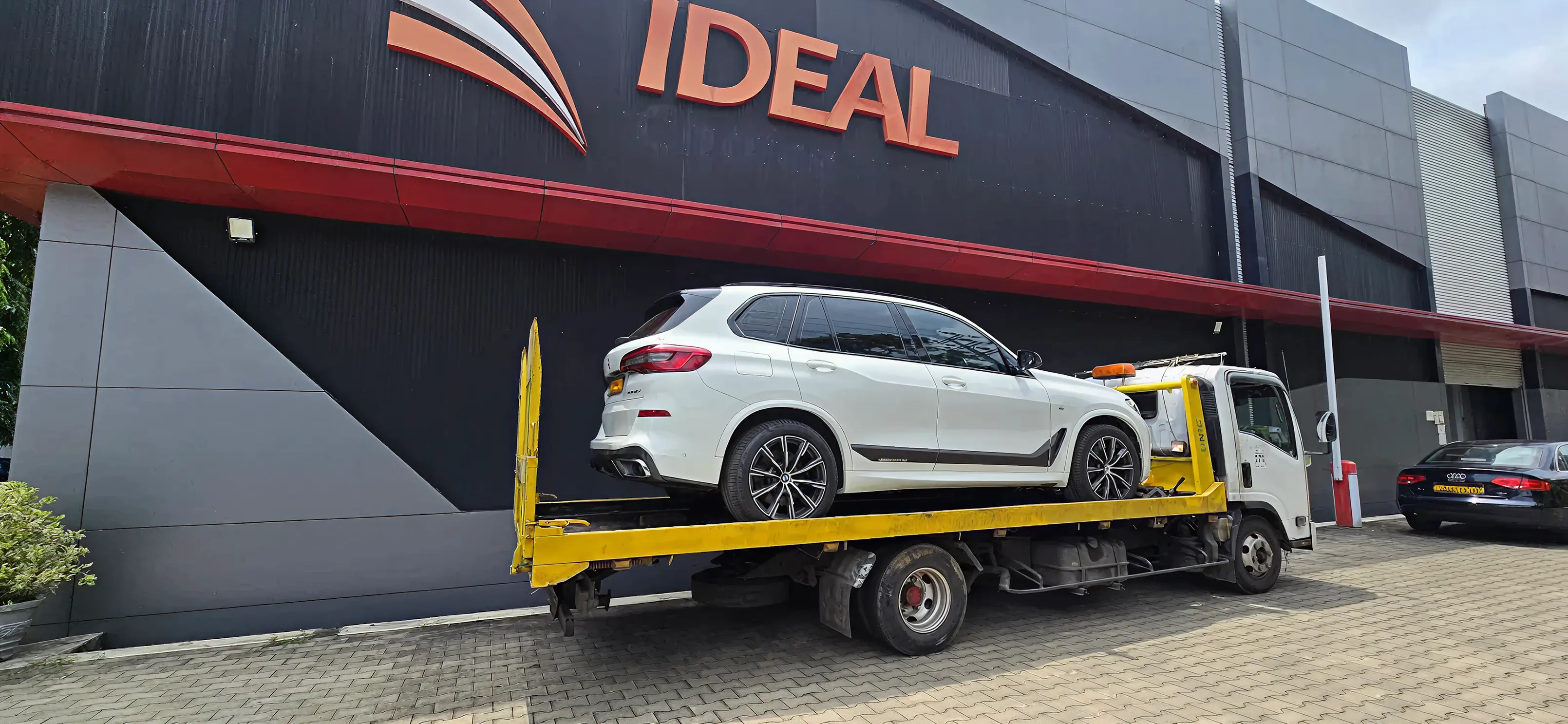 Car being towed on the road