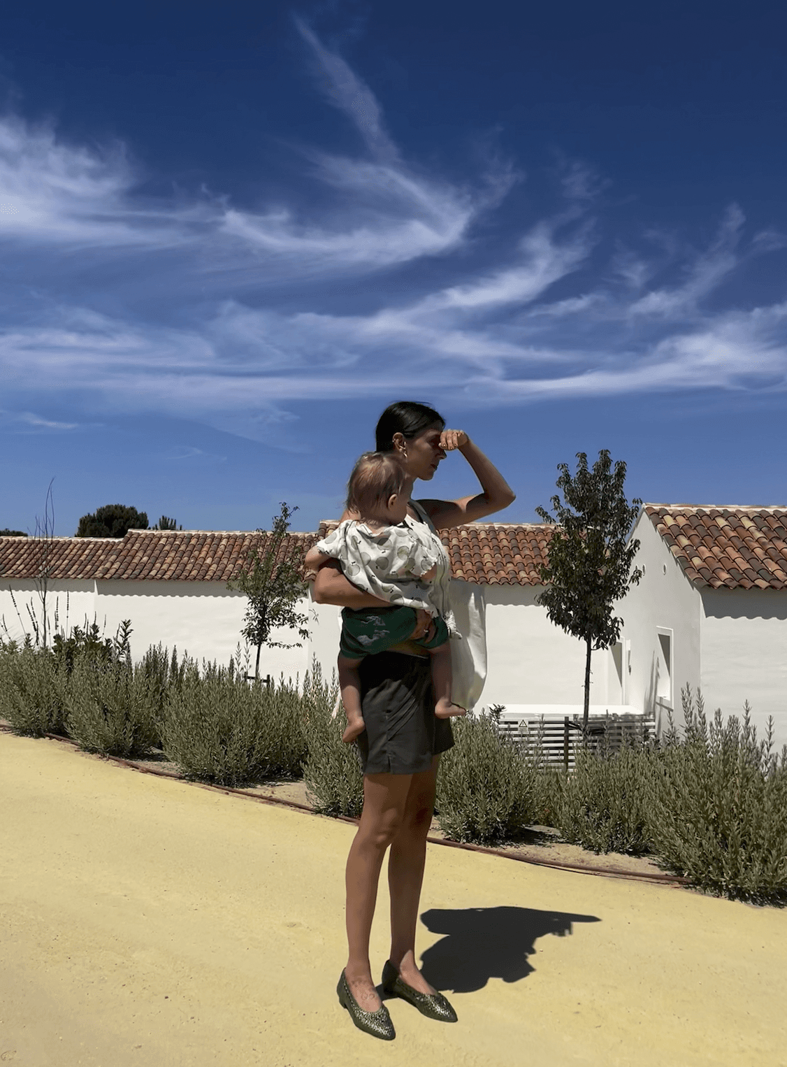 Lottie Murphy in Portugal holding son Sebby