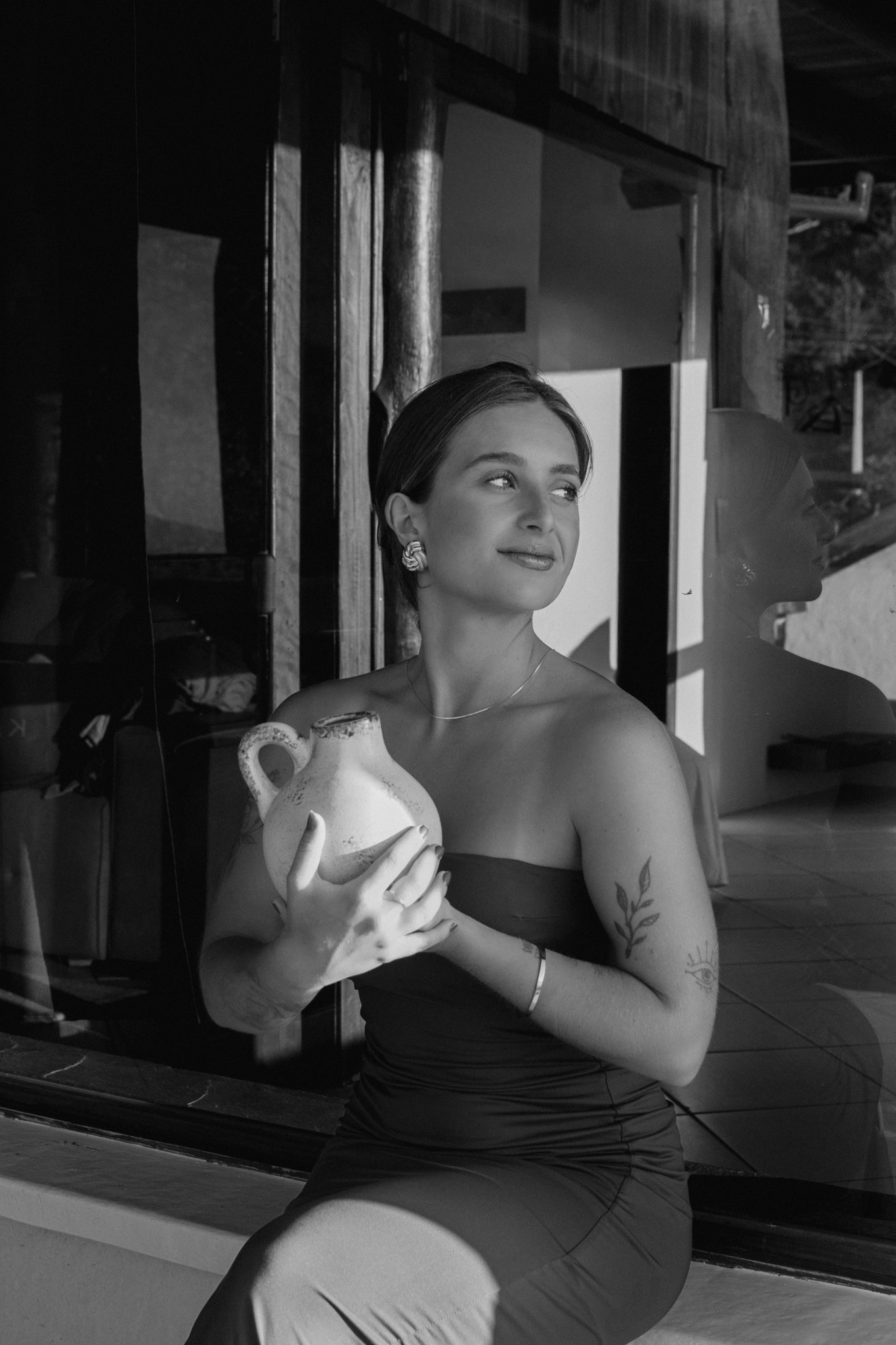 Close up of a woman with eyes closed practicing deep breathing