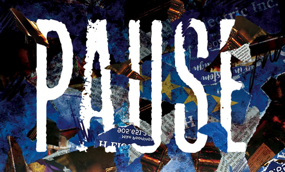 A close up of poster saying PAUSE