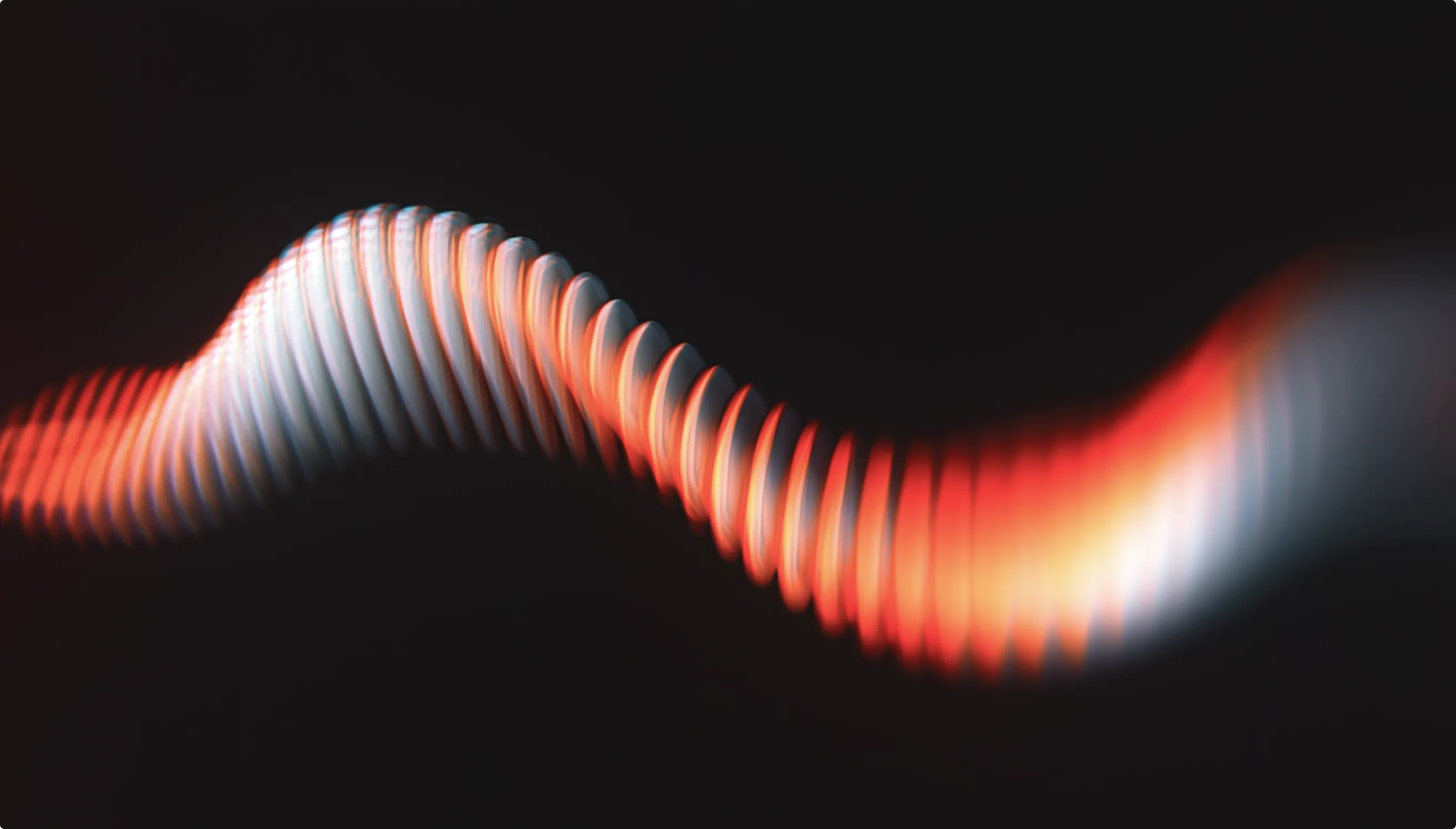 Wavy line of red and white light on a black background.