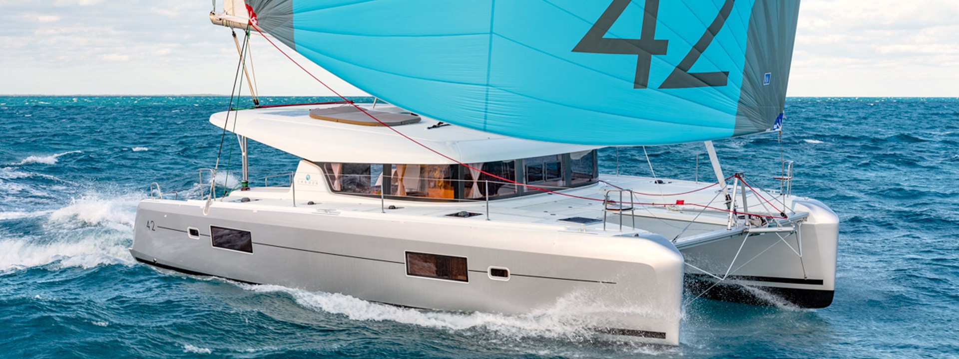 White Rock 36 speedboat with captain at helm cruising calm blue waters near Paros coastline with hills in background.