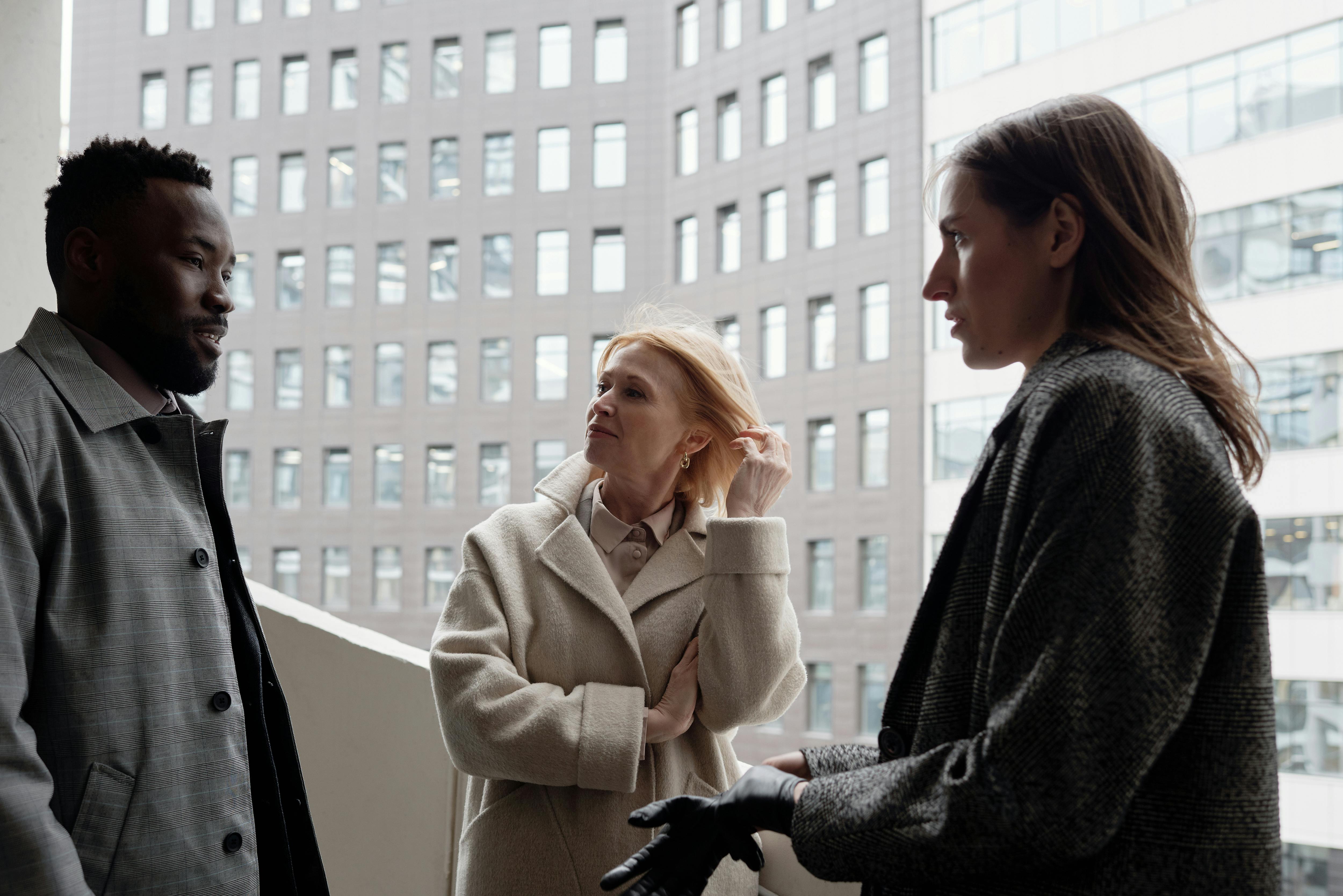 Agents talking outside the building