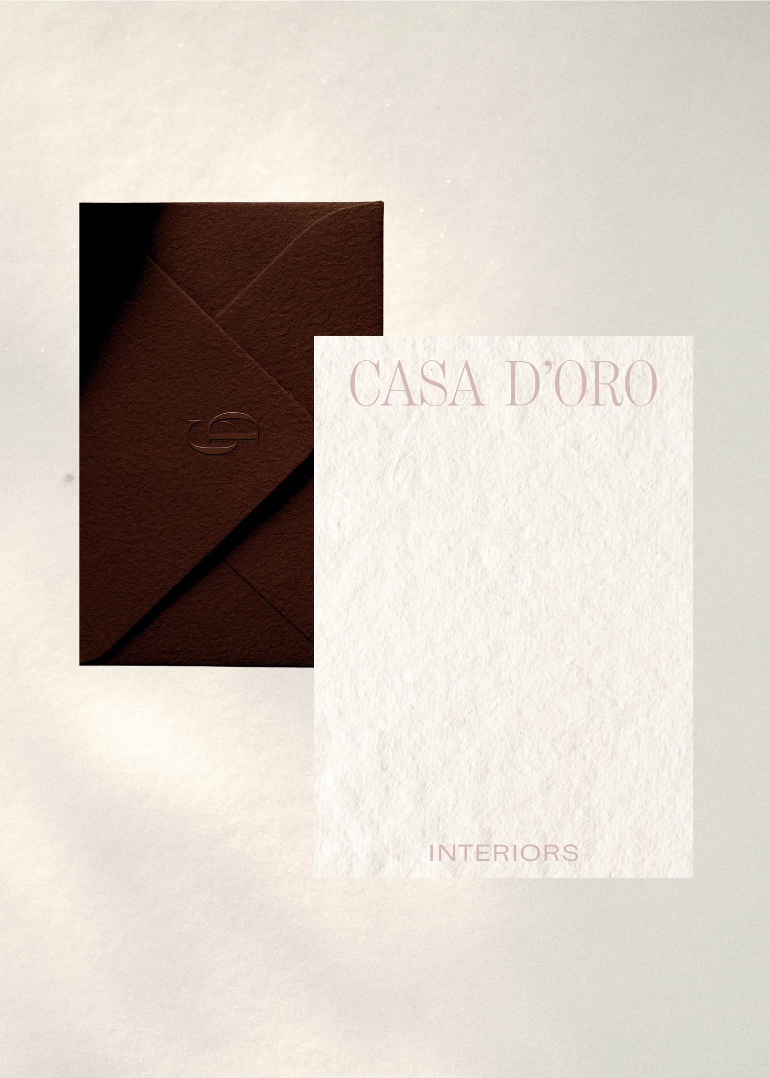 Casa D’Oro premium business card design on textured paper with minimalist luxury branding.