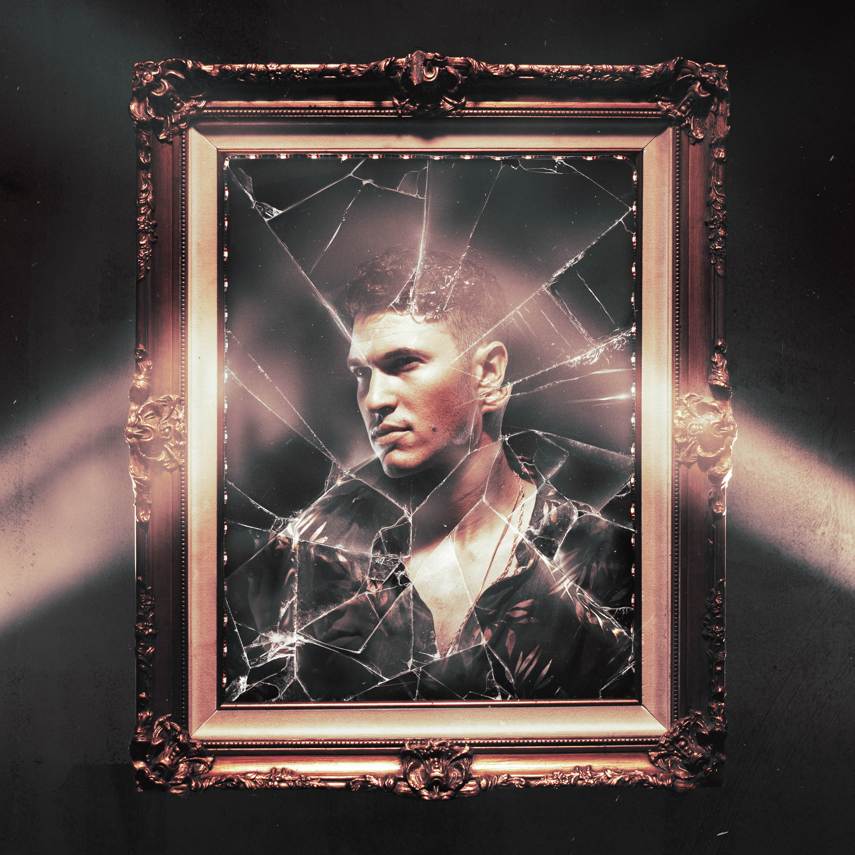 An album cover by creative director Owen Brown featuring a gold frame with a shattered mirror inside of it, as well as the reflection of the musician Cal