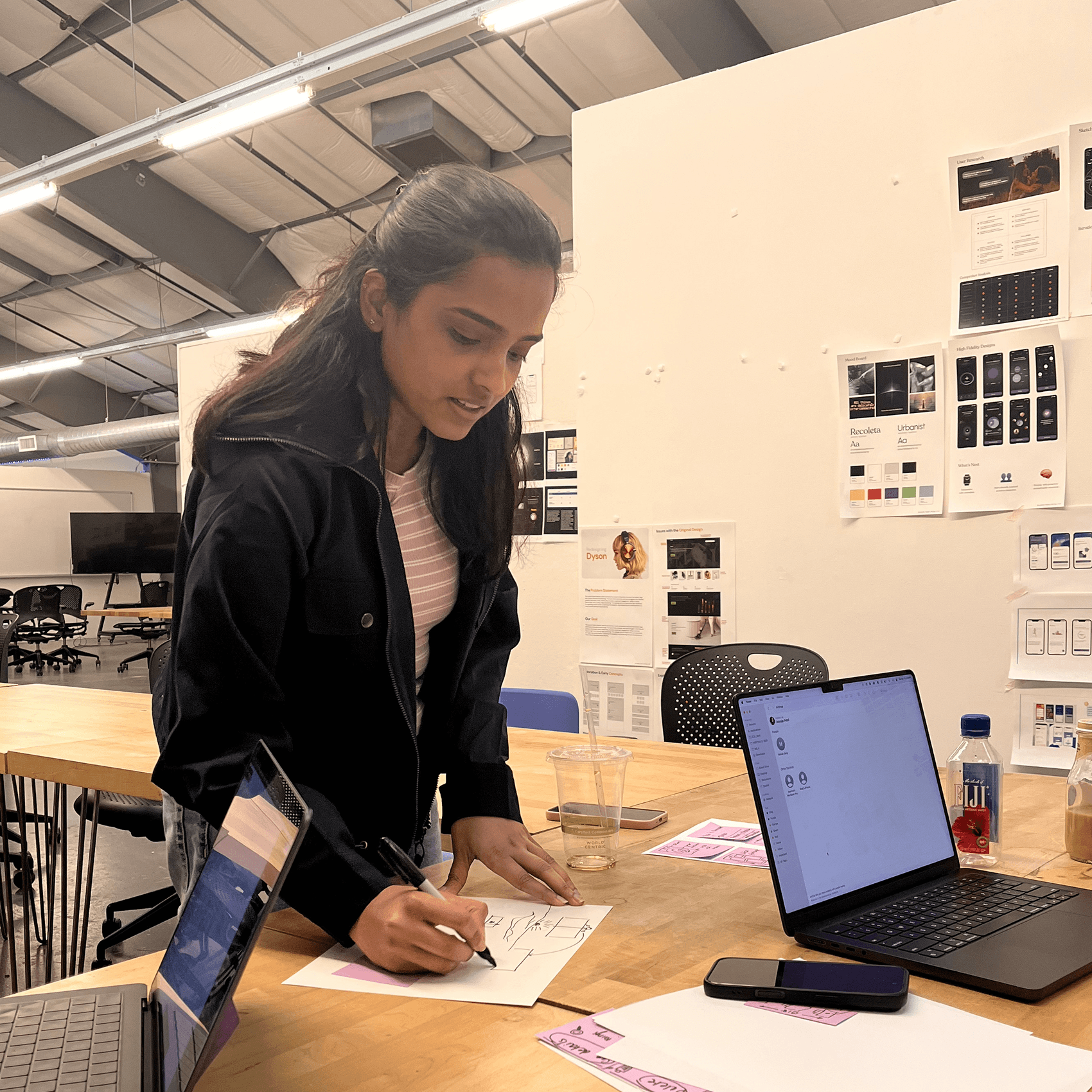 Abstract glowing orange book-shaped form on a dark background