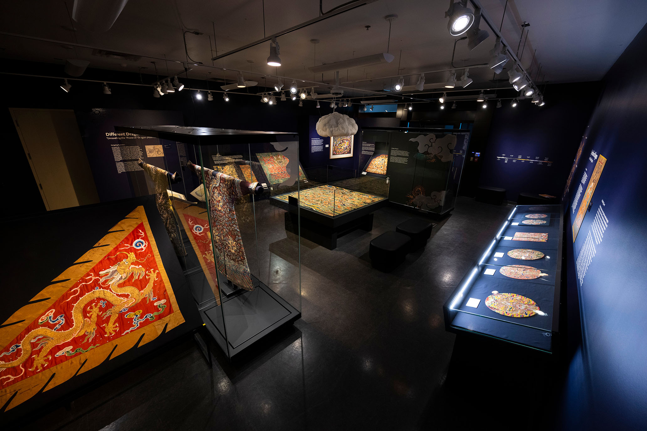 a birds eye view of a museum exhibit showing ancient chinese textiles