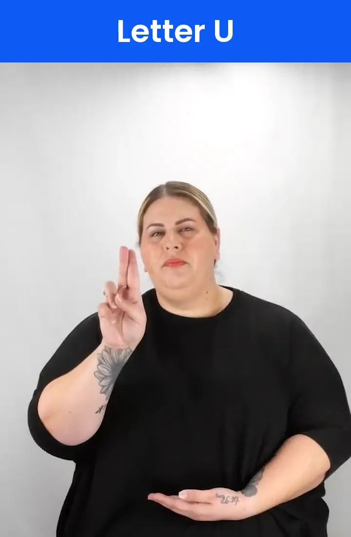 A Deaf signer signs U in ASL