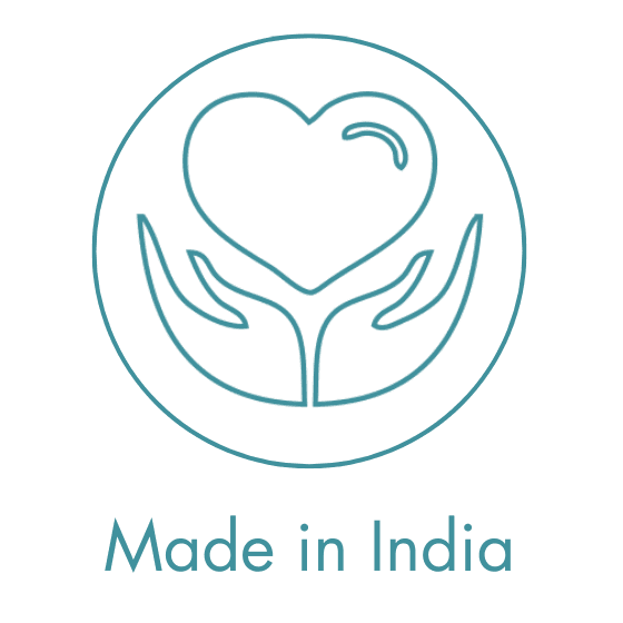 A woman lying down with a towel wrapped around her head, her face glistening with facial oil. Her eyes are closed, and she appears to be enjoying a spa treatment in a peaceful setting.