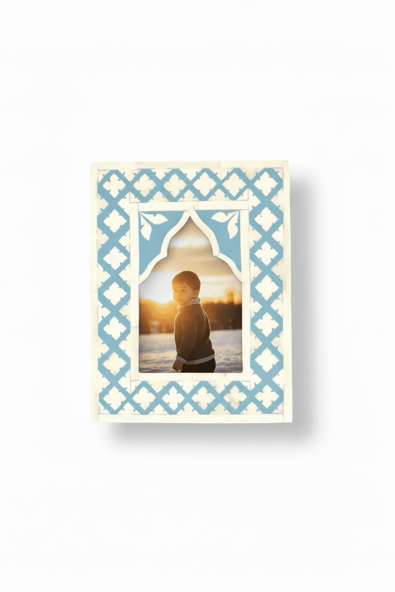 Decorative photo frame with a blue geometric pattern on a white background