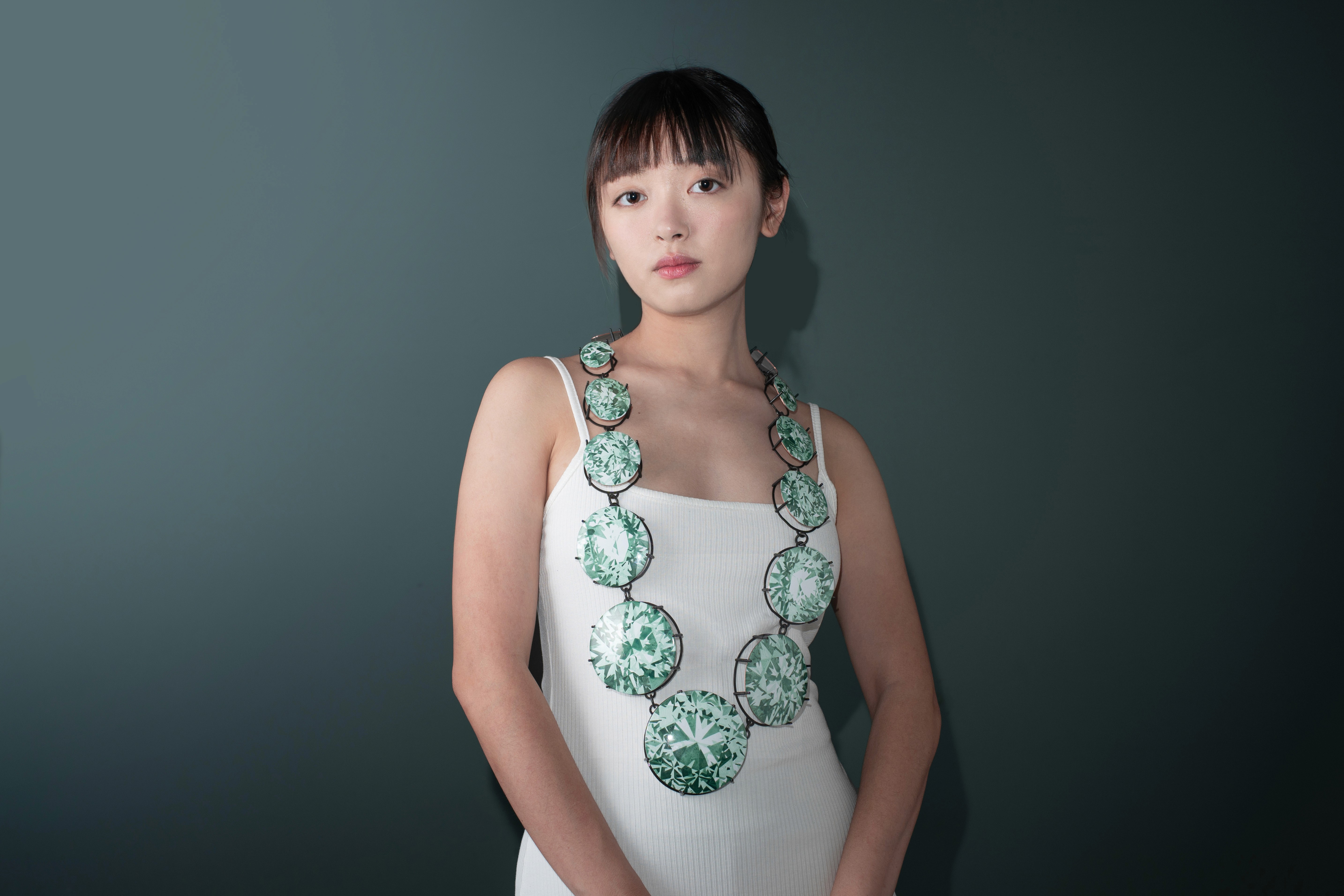 Gem by Yuxin Song worn by a model, painted enamel on copper, contemporary jewelry necklace, selected for SCHMUCK 2026 Munich