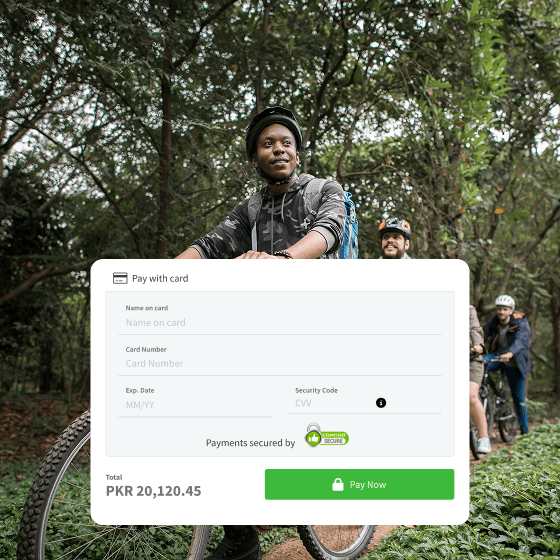 Tour guide and group of friends riding bicycles on a forest trail, smiling and wearing helmets.