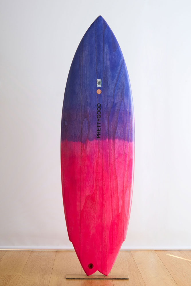 Purple and pink wooden surfboard