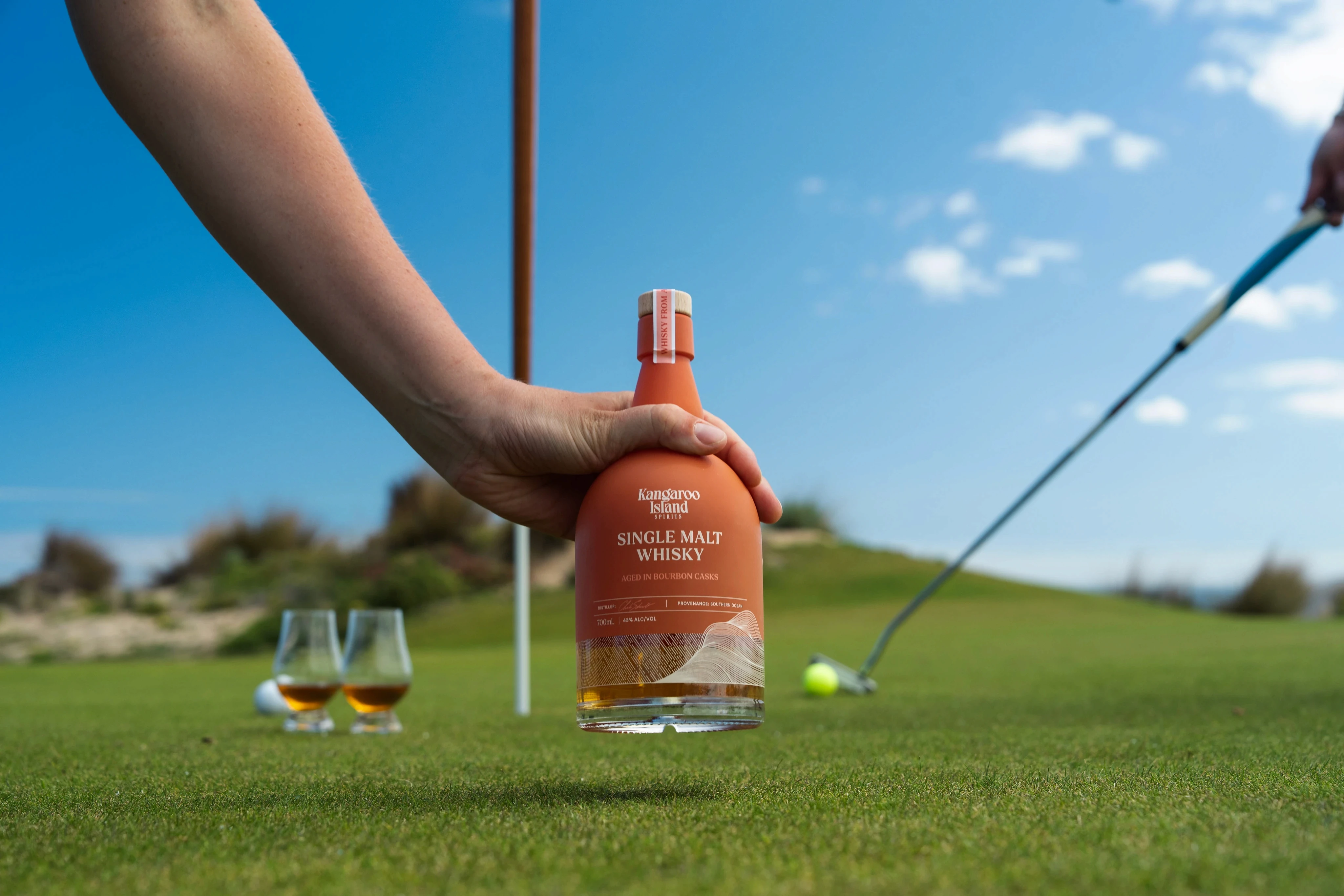ki spirits whisky on a beach in kangaroo island in water