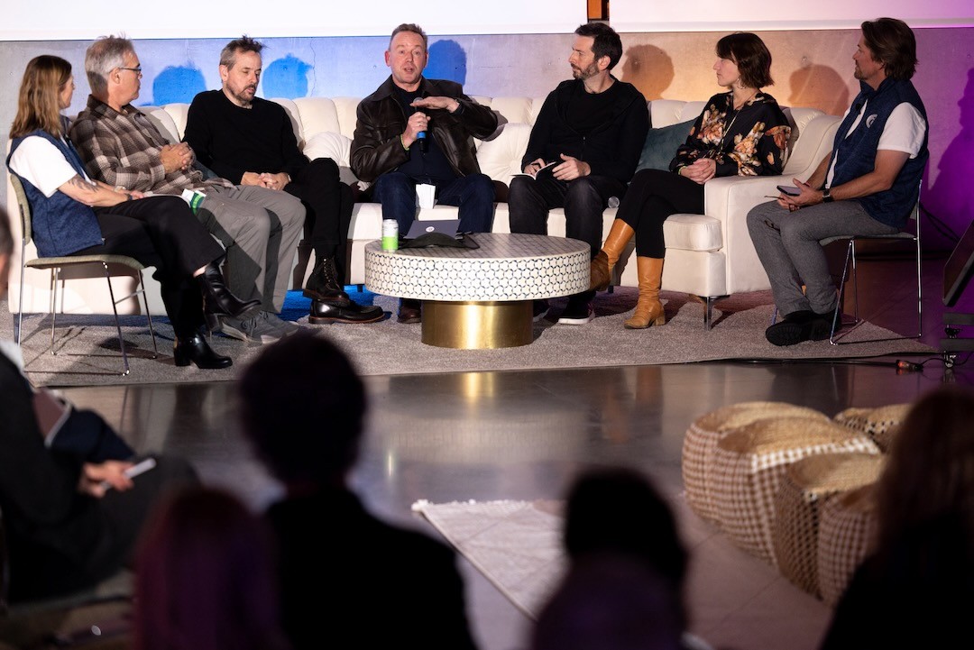 A woman talking into a microphone at the Artificiality Summit