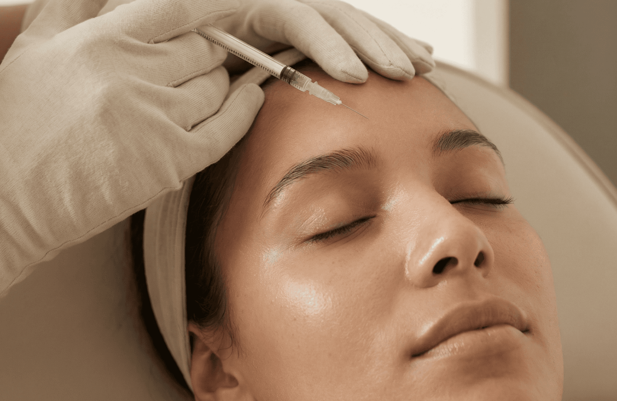 Woman relaxing before injectable or PRP treatment designed to smooth wrinkles, restore facial volume, and boost collagen naturally.