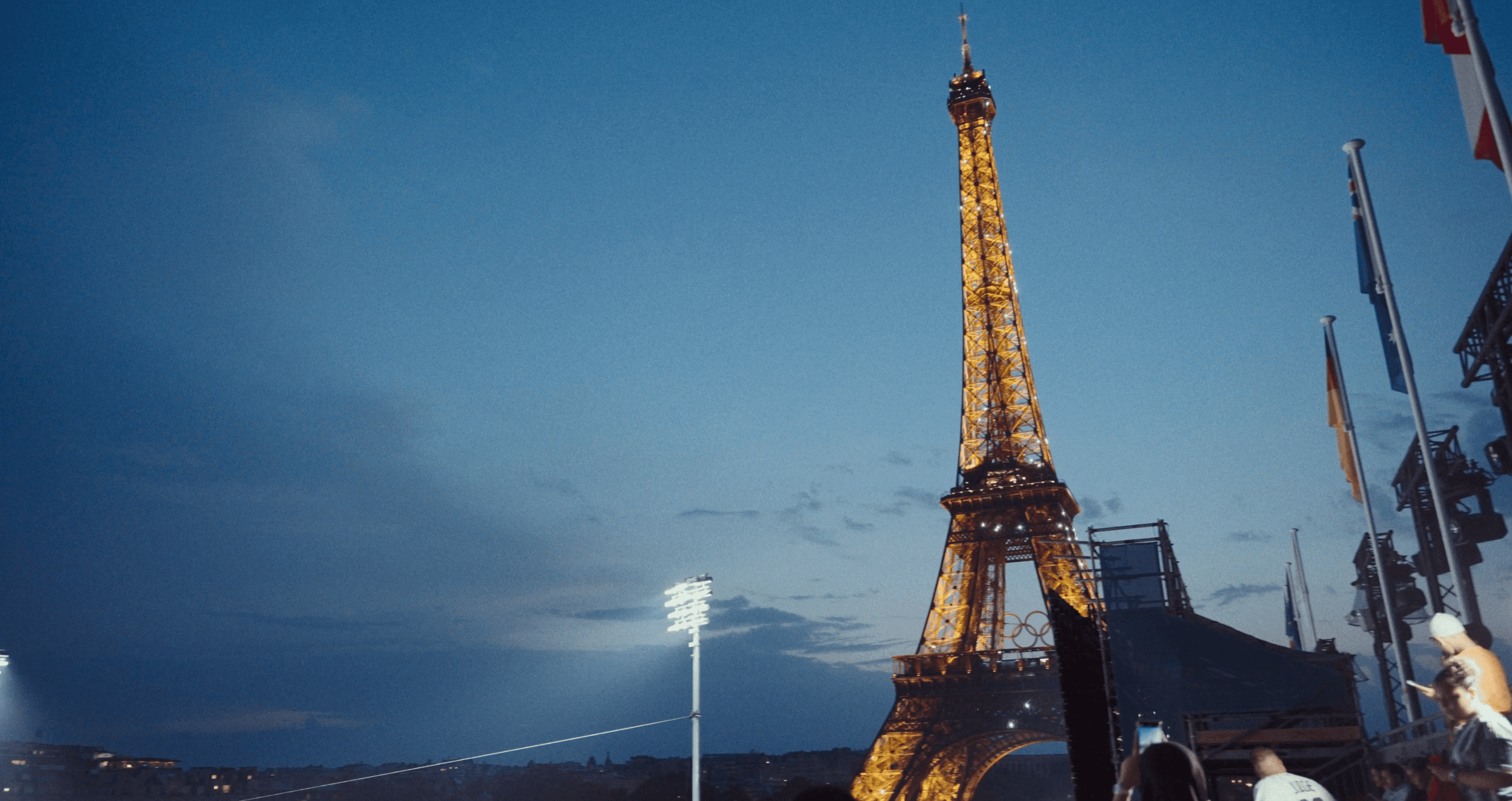 a woman holding a red flower