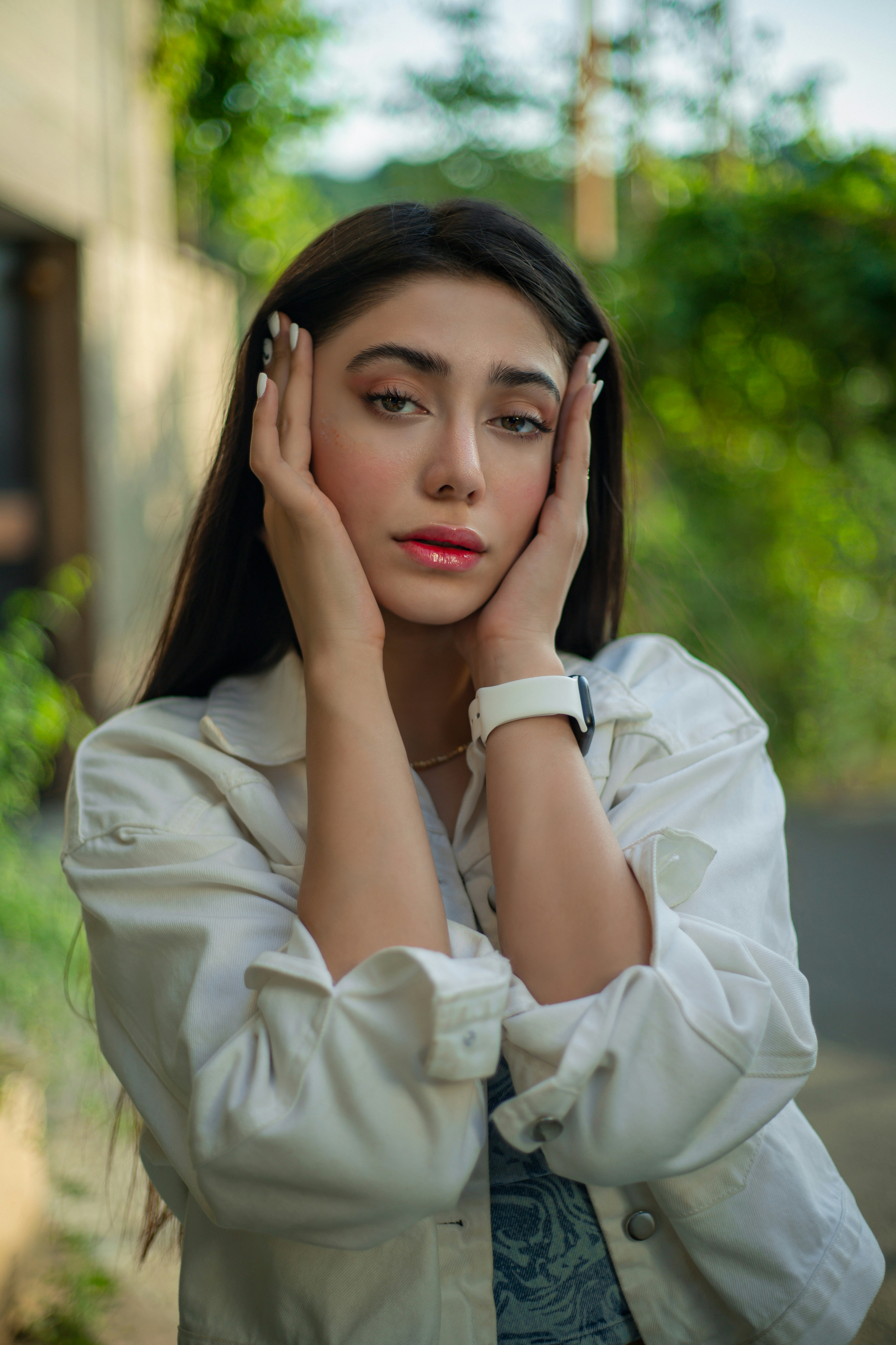 A woman with her hands on her head