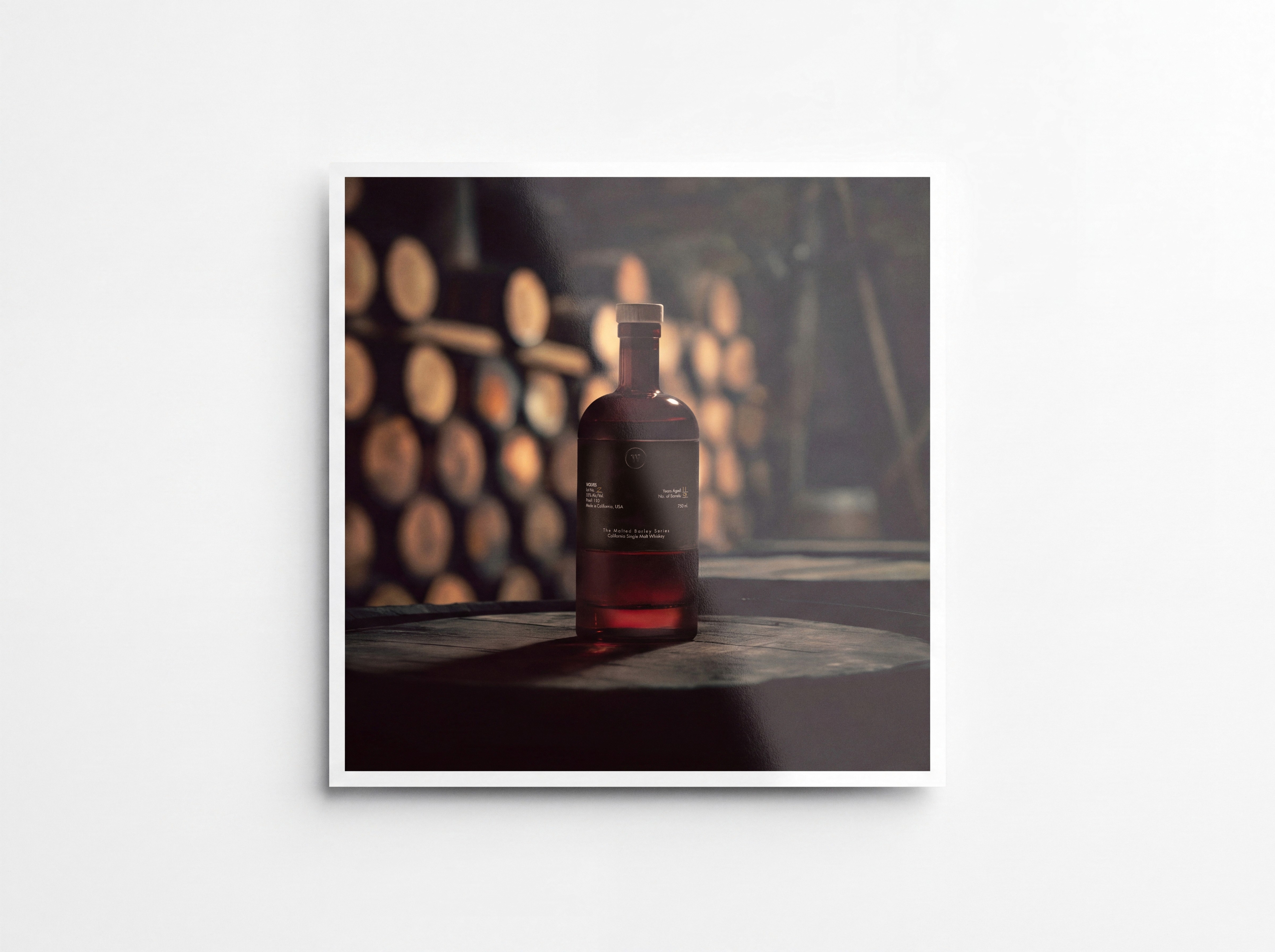 A 2024 hybrid image for Wolves Whiskey: studio-photographed bottle composited into an AI-generated barrel room, from Ford Media Lab's early hybrid era.