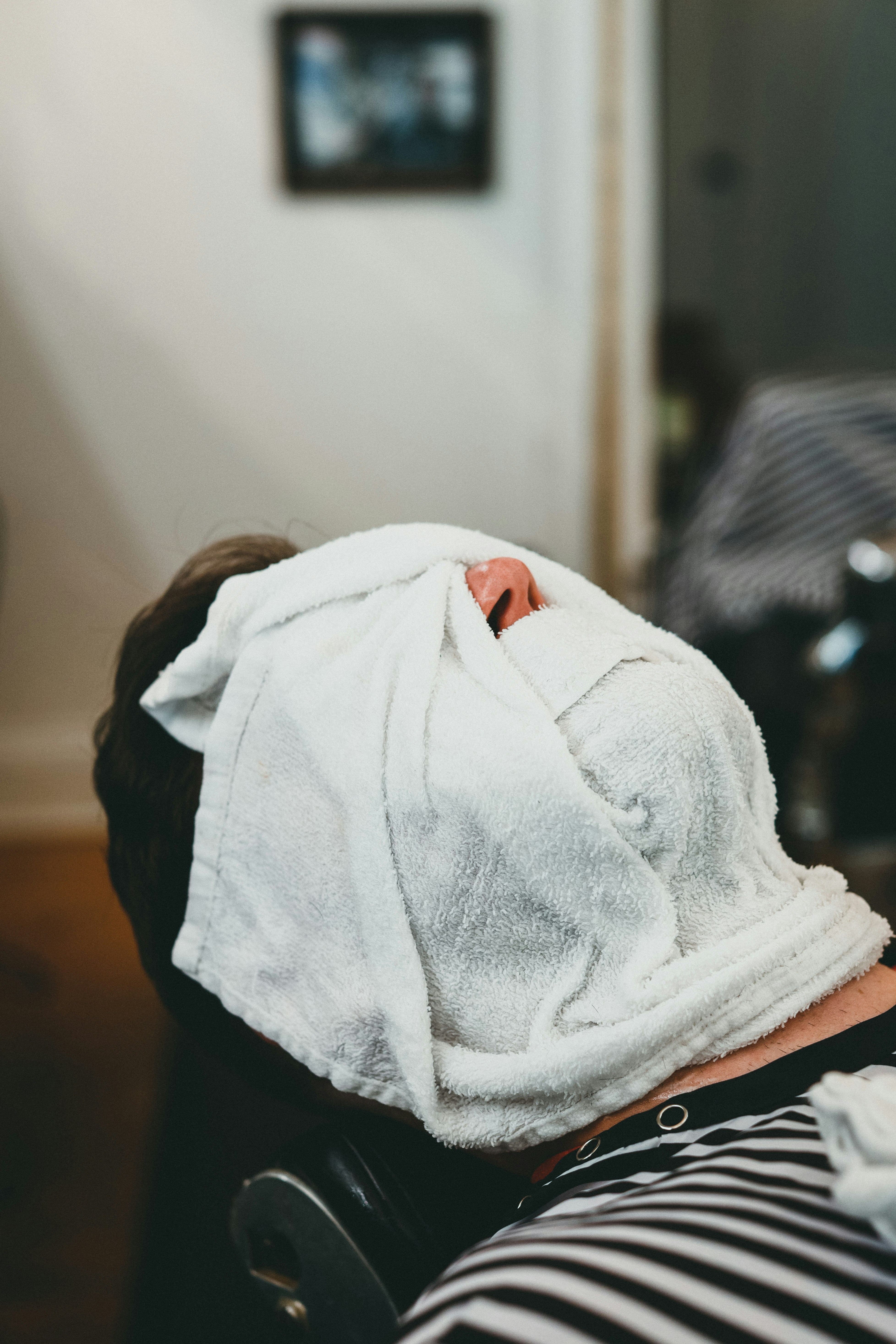 a person with a towel on their head