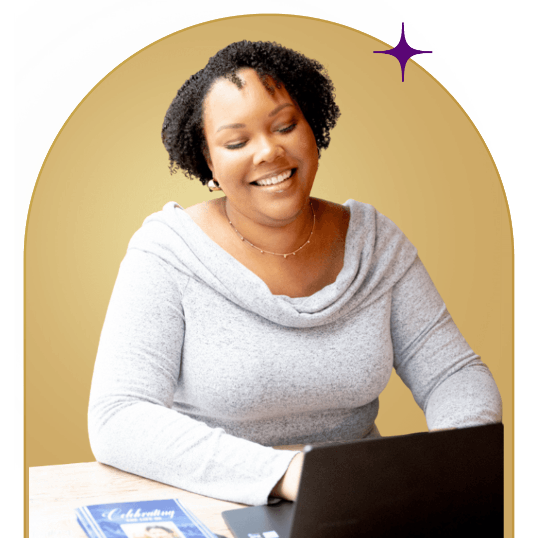 A woman smiles while using a laptop, engaged in digital design, representing beginner designers in the creative economy.