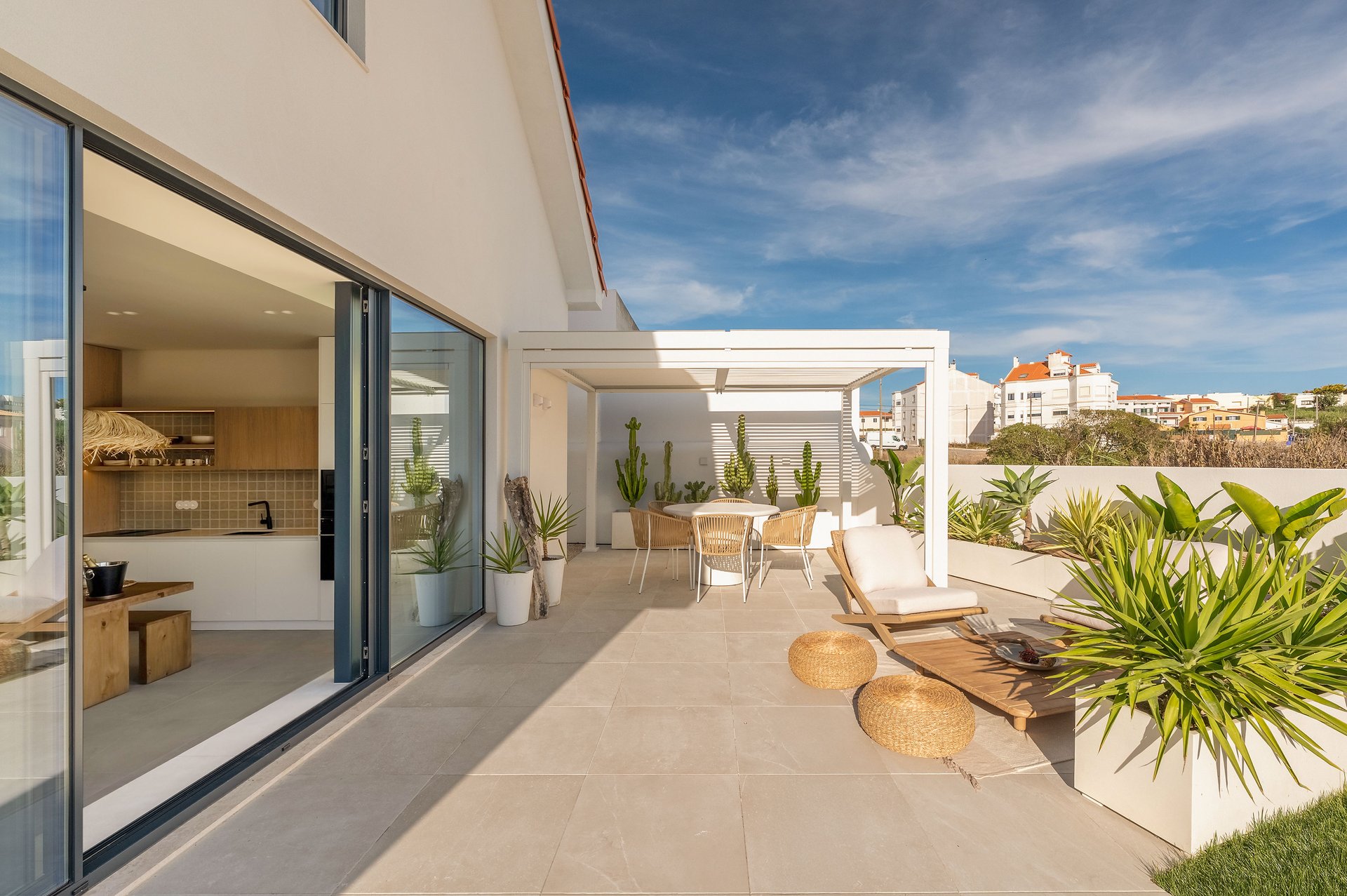 Outdoor terrace lounge with garden view at Villa Flora