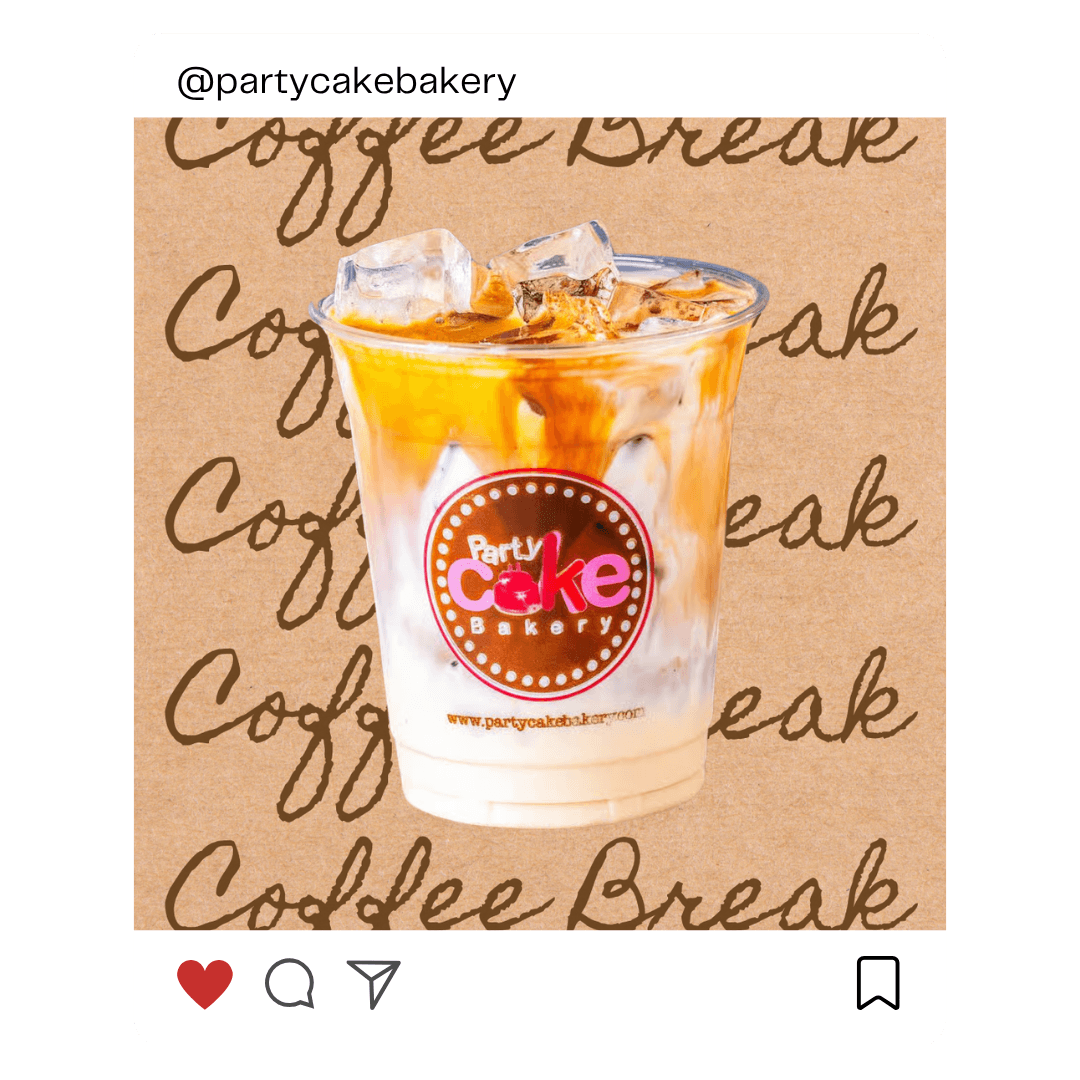 A dog sits on the grass, silhouetted against a beautiful sunset in the background.