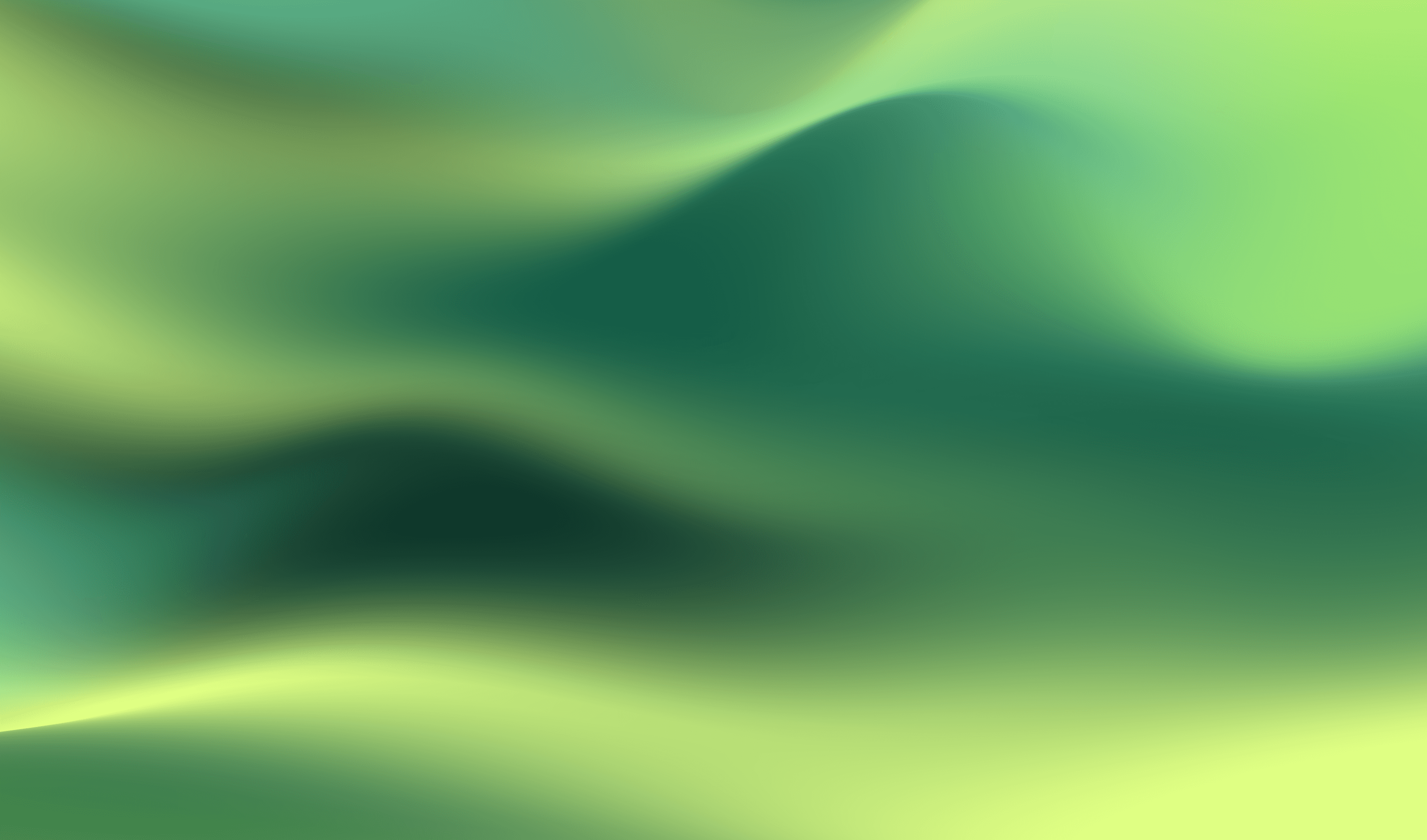 Two colleagues collaborating over paperwork at an office desk, with plants in the background.