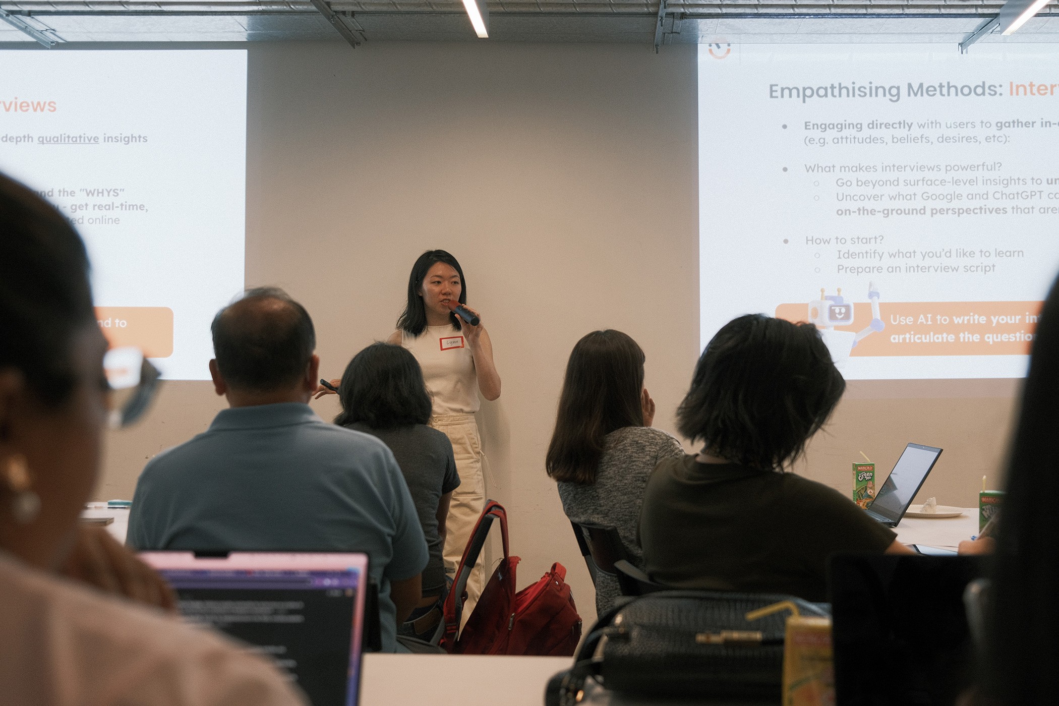 A frontal angle of Lynn presenting to participants.