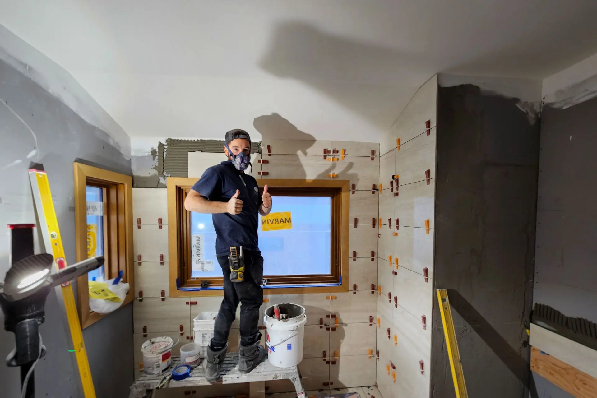 Bathroom renovation in progress in Whistler, BC, with new tile work underway.