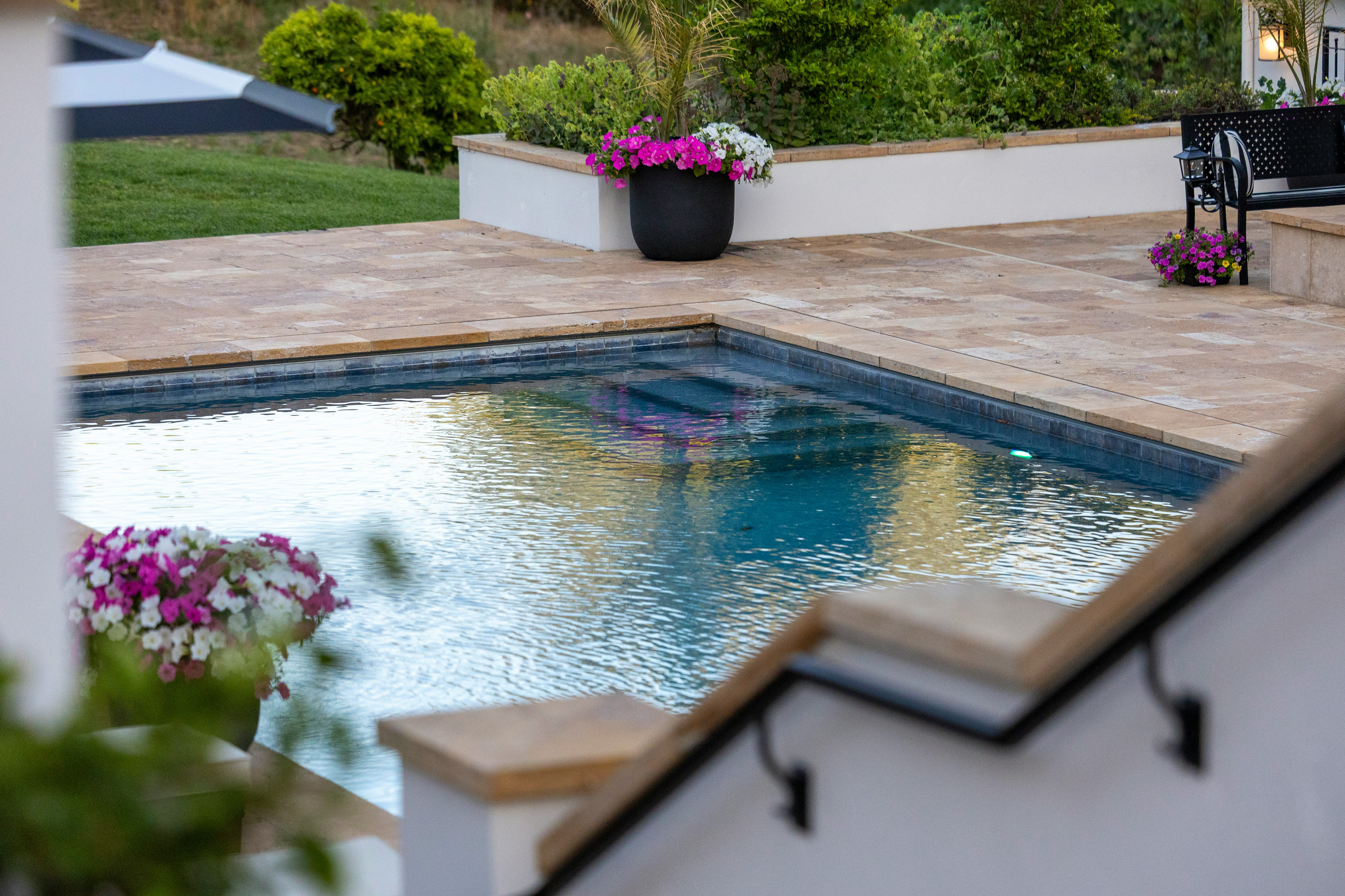 Family enjoying a completed backyard pool