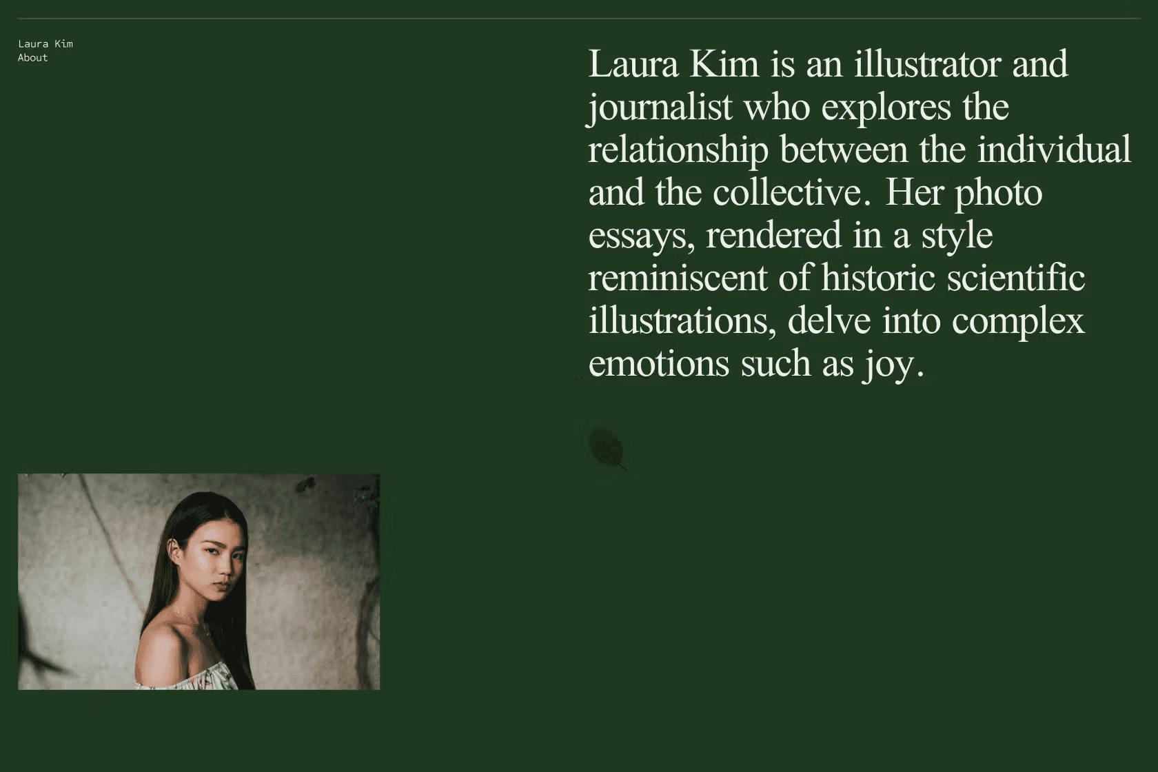 Young person with curly hair wearing blue clothing, smiling at camera