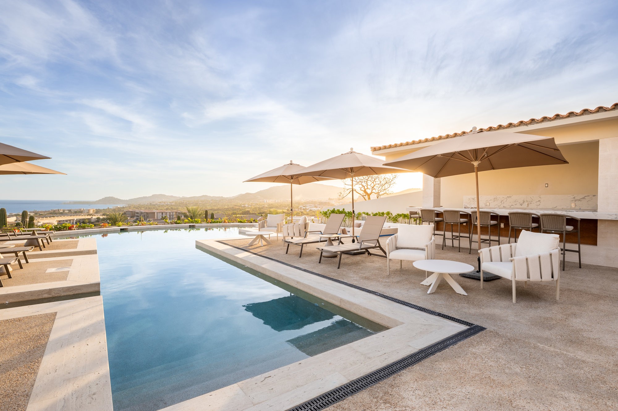 grayscale photo of person wearing black watch and black dslr camera