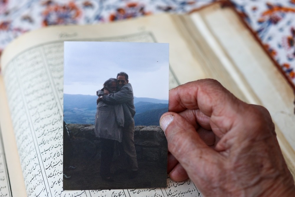 Bubjan with book and speaking to camera